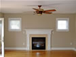 This modular home includes a gas fireplace with custom oak wood mantel and surround 